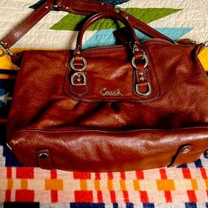Coach dark brown leather bag with purple lining retails $348